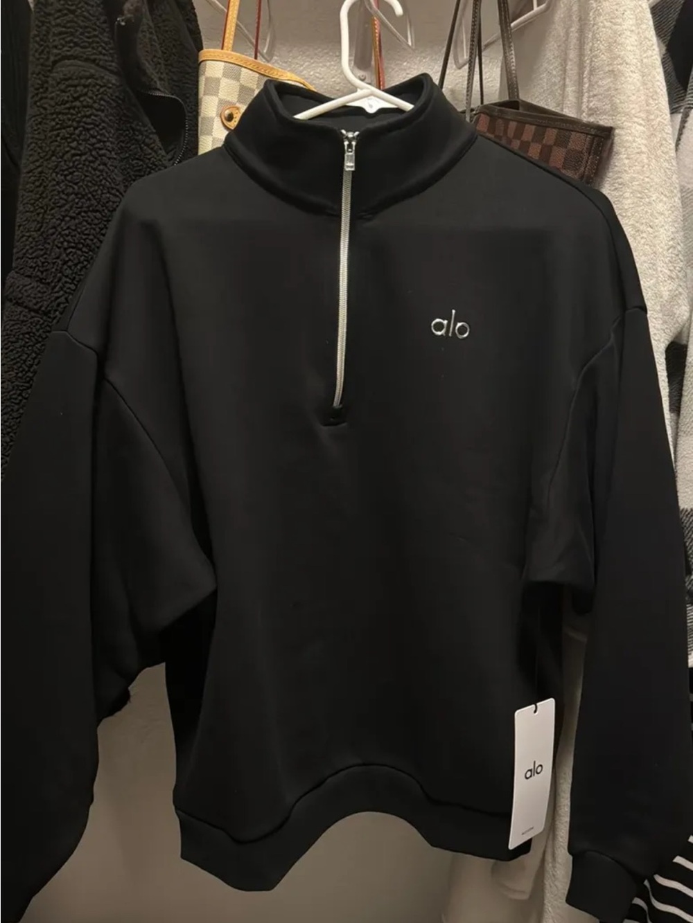 ALO Yoga women’s Black Half-Zip Pullover with Silver Zip